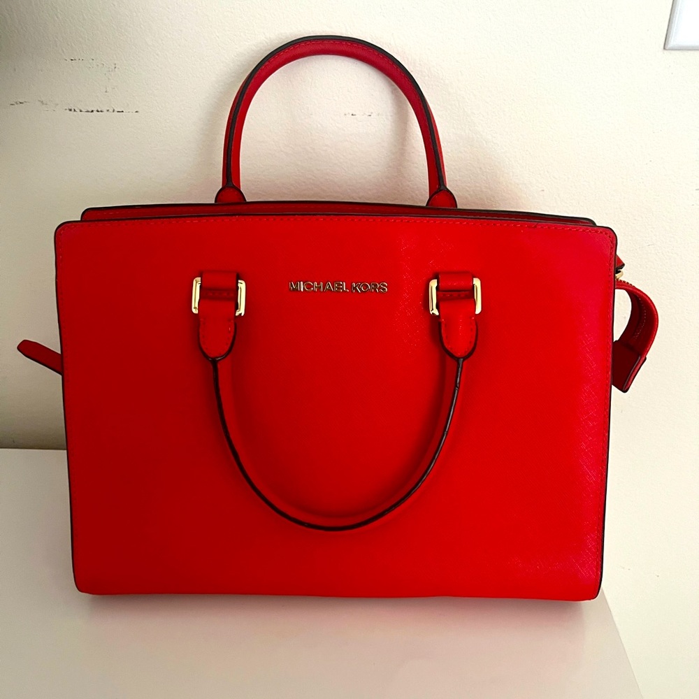 Red-orange Michael Kors tote bag with strap
